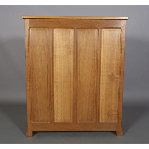 465 - COLIN ALMACK 'BEAVERMAN', an oak chest of five graduated drawers, iron loop handles, field panelled ... 