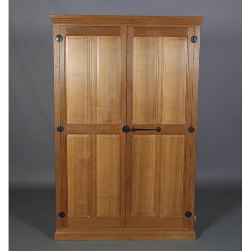 464 - COLIN ALMACK 'BEAVERMAN', an oak two door wardrobe having a moulded cornice above two field-panelled... 