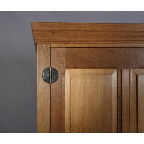 464 - COLIN ALMACK 'BEAVERMAN', an oak two door wardrobe having a moulded cornice above two field-panelled... 