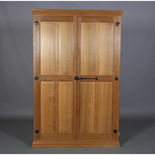 464 - COLIN ALMACK 'BEAVERMAN', an oak two door wardrobe having a moulded cornice above two field-panelled... 