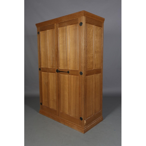 464 - COLIN ALMACK 'BEAVERMAN', an oak two door wardrobe having a moulded cornice above two field-panelled... 