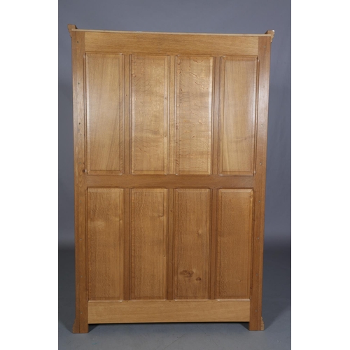 464 - COLIN ALMACK 'BEAVERMAN', an oak two door wardrobe having a moulded cornice above two field-panelled... 