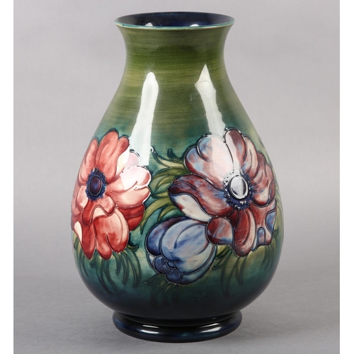 271 - A MOORCROFT VASE of baluster form, painted and tube lined in the Anemone pattern in pinks and purple... 