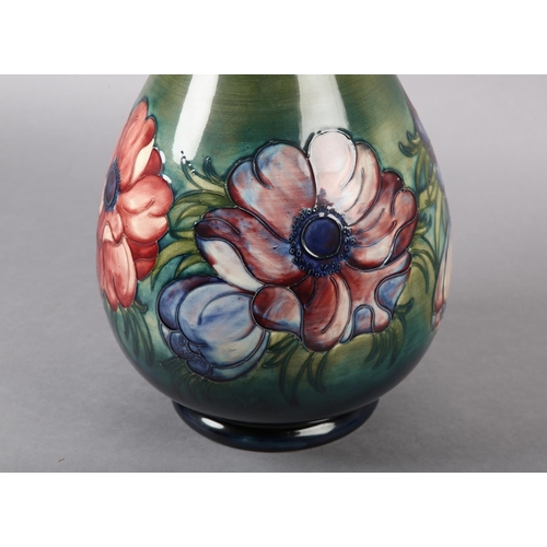 271 - A MOORCROFT VASE of baluster form, painted and tube lined in the Anemone pattern in pinks and purple... 