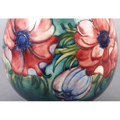 271 - A MOORCROFT VASE of baluster form, painted and tube lined in the Anemone pattern in pinks and purple... 