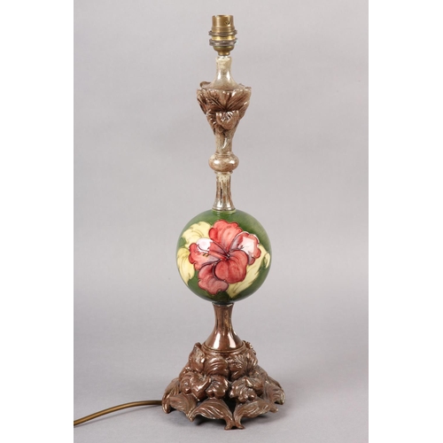 272 - A MOORCROFT TABLE LAMP, having a globular centre painted and tube lined in the Hibiscus pattern with... 