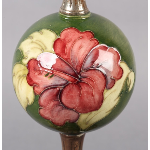 272 - A MOORCROFT TABLE LAMP, having a globular centre painted and tube lined in the Hibiscus pattern with... 