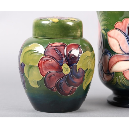 274 - A MOORCROFT JARDINIERE painted and tube lined in the Anemone pattern in pinks and purples on a green... 