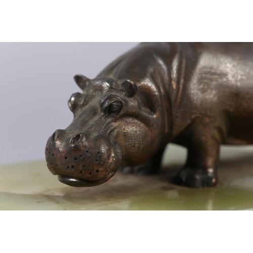 231 - AN ASPREY OF LONDON ONYX INK BLOTTER with a figure of a bronze effect hippopotamus, stamped Asprey L... 