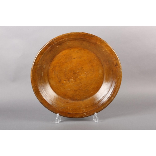 175 - A LATE 18TH/EARLY 19TH CENTURY LARGE FRUITWOOD BOWL, ring turned and shallow with a wide rim, flat b... 