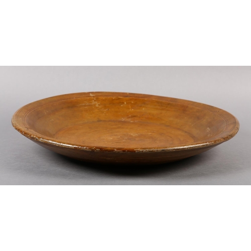 175 - A LATE 18TH/EARLY 19TH CENTURY LARGE FRUITWOOD BOWL, ring turned and shallow with a wide rim, flat b... 