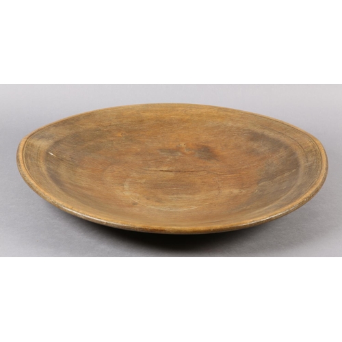 176 - A LATE 18TH / EARLY 19TH CENTURY TURNED FRUITWOOD BOWL, shallow with gently sloping edges, 32cm diam... 