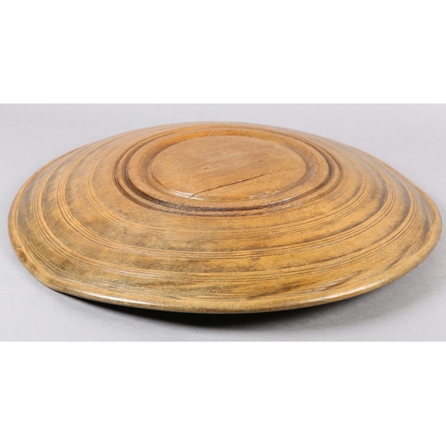 176 - A LATE 18TH / EARLY 19TH CENTURY TURNED FRUITWOOD BOWL, shallow with gently sloping edges, 32cm diam... 