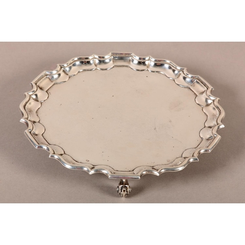 327 - AN EDWARD VI SILVER SALVER London 1909 for Thomas Bradbury & Sons Ltd, bracketed rim of circular out... 