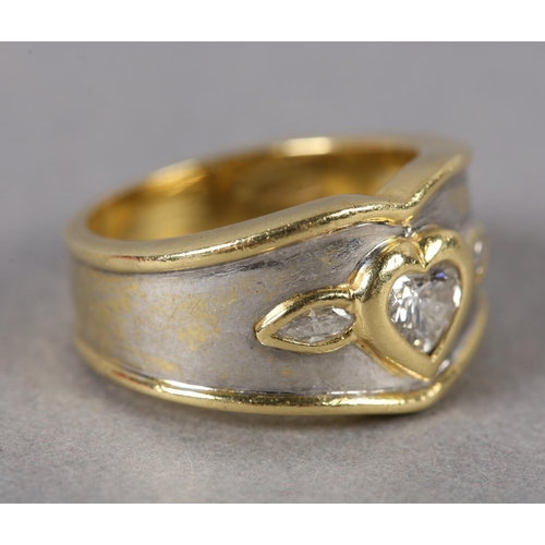 371 - A THREE STONE DIAMOND RING collet set in yellow metal to the centre with a heart shaped faceted ston... 