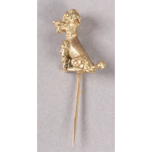 380 - A TIE PIN in 9ct gold, set with a seated standard poodle in full relief, c1962, approximate weight 7... 