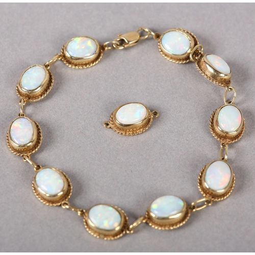 375 - AN OPAL BRACELET in 9ct gold, each link collet set with an oval cabochon stone within a twisted wire... 