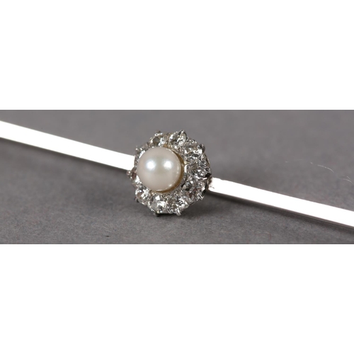 350 - A CULTURED PEARL AND DIAMOND CLUSTER BAR BROOCH, the 5mm pearl raised against a surround of claw set... 