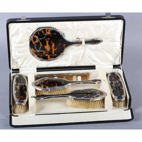 331 - A GEORGE V TORTOISESHELL AND SILVER DRESSING TABLE SET, Birmingham 1925 for Williams Ltd, the hand m... 