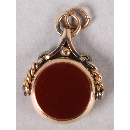 388 - A VICTORIAN BLOODSTONE AND CORNELIAN SWIVEL FOB in 9ct rose gold, Chester 1889 for George K Leeson, ... 