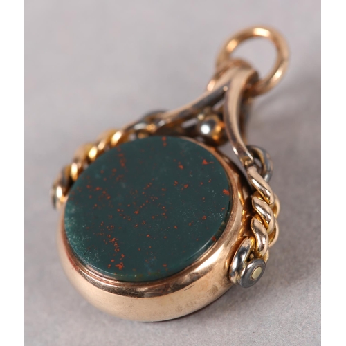 388 - A VICTORIAN BLOODSTONE AND CORNELIAN SWIVEL FOB in 9ct rose gold, Chester 1889 for George K Leeson, ... 