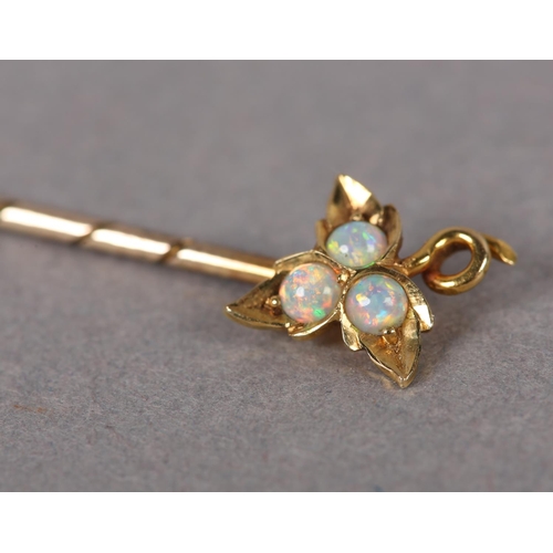 390 - A LATE VICTORIAN OPAL STICK PIN in 15ct gold with 9ct gold pin, the three circular cabochon stones g... 