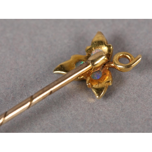 390 - A LATE VICTORIAN OPAL STICK PIN in 15ct gold with 9ct gold pin, the three circular cabochon stones g... 