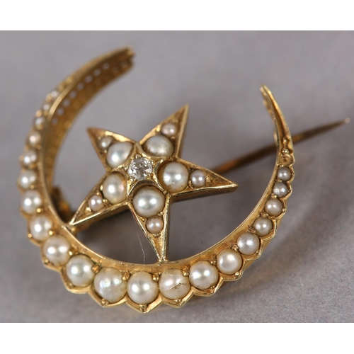 357 - A VICTORIAN SEED PEARL AND DIAMOND CRESCENT AND STAR BROOCH in 15ct gold, all over set with graduate... 