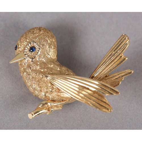 358 - A SONG BIRD BROOCH c1960, in half relief with sapphire set eyes in yellow metal (tests as 14ct gold)... 