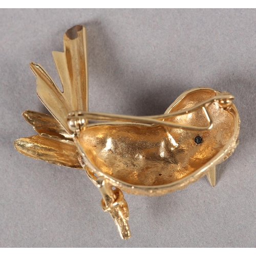 358 - A SONG BIRD BROOCH c1960, in half relief with sapphire set eyes in yellow metal (tests as 14ct gold)... 