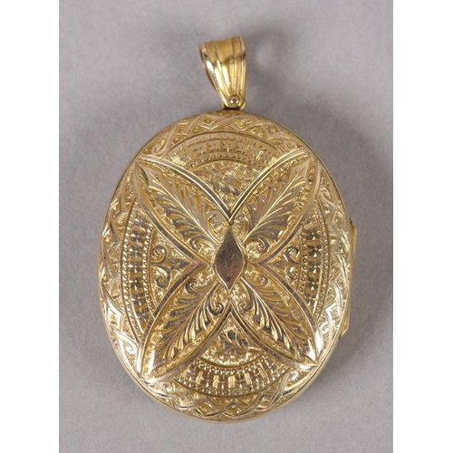 360 - A VICTORIAN OVAL LOCKET in 9ct gold, back and front, foliate engraved with belted surround to the fr... 