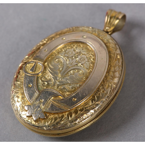 360 - A VICTORIAN OVAL LOCKET in 9ct gold, back and front, foliate engraved with belted surround to the fr... 