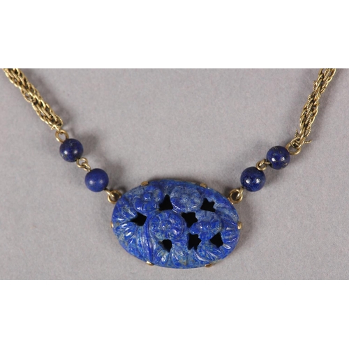 369 - A SODALITE NECKLACE  c1950 in 9ct gold, the foliate pierced and carved oval cabochon claw set, flank... 