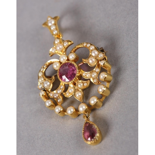 370 - A VICTORIAN PINK TOPAZ AND SEED PEARL PENDANT in 15ct gold, collet set to the centre with a circular... 