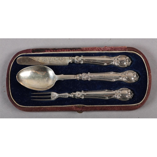 323 - A VICTORIAN THREE PIECE CHRISTENING SET in silver, Birmingham 1861 for George Unite, the fork, spoon... 