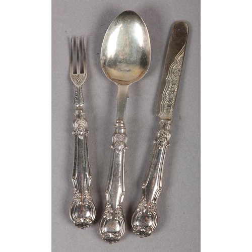 323 - A VICTORIAN THREE PIECE CHRISTENING SET in silver, Birmingham 1861 for George Unite, the fork, spoon... 