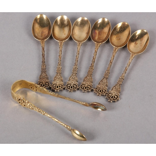 329 - A SET OF SIX VICTORIAN SILVER GILT TEASPOONS AND SUGAR TONGS, London 1895 for Wakely & Wheeler, each... 