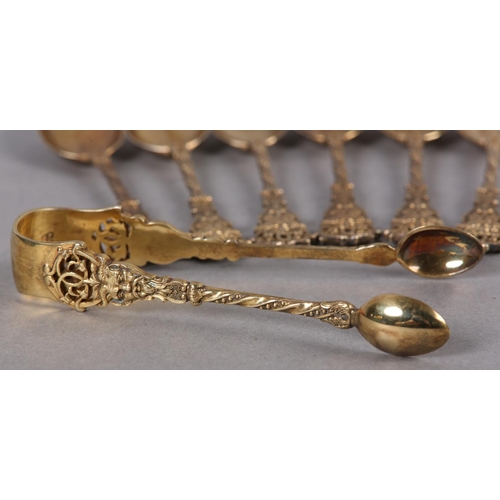 329 - A SET OF SIX VICTORIAN SILVER GILT TEASPOONS AND SUGAR TONGS, London 1895 for Wakely & Wheeler, each... 