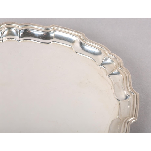 334 - AN ELIZABETH II SILVER SALVER, Birmingham 1969 for Barker Ellis Silver Co, bracketed rim over four s... 