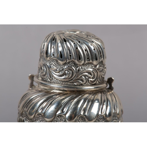 324 - A VICTORIAN SILVER MUFFINEER , London 1892 for Samuel Jacob, wrythen chased with foliate band over w... 