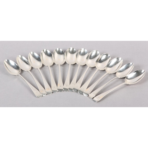 317 - A SET OF TWELVE GEORGE V SILVER DESSERT SPOONS 1923 for Wakely & Wheeler, Hanoverian pattern with la... 