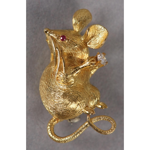 354 - A RUBY AND DIAMOND MOUSE BROOCH c1970, slightly stylised, seated in detailed half relief, set to the... 