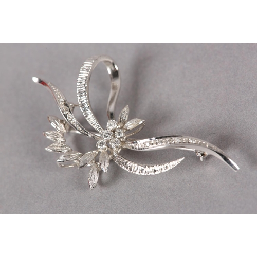 363 - A DIAMOND CLUSTER SPRAY BROOCH in 18ct white gold c1973, claw set to the centre with brilliant cut s... 