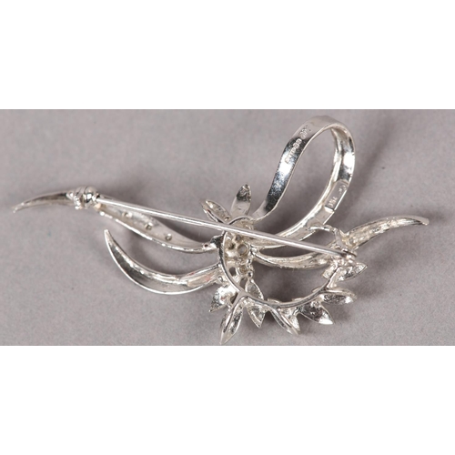 363 - A DIAMOND CLUSTER SPRAY BROOCH in 18ct white gold c1973, claw set to the centre with brilliant cut s... 