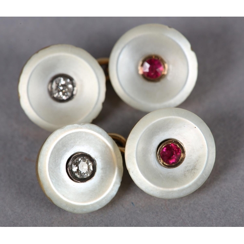 384 - A PAIR OF EDWARD VII RUBY, DIAMOND AND MOTHER OF PEARL CUFFLINKS in 15ct gold, each circular concave... 