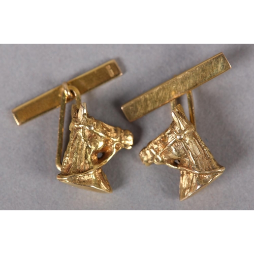 385 - A PAIR OF HORSE'S HEAD CUFFLINKS in 9ct gold, c1978, in full relief wearing bridal and bit joined to... 