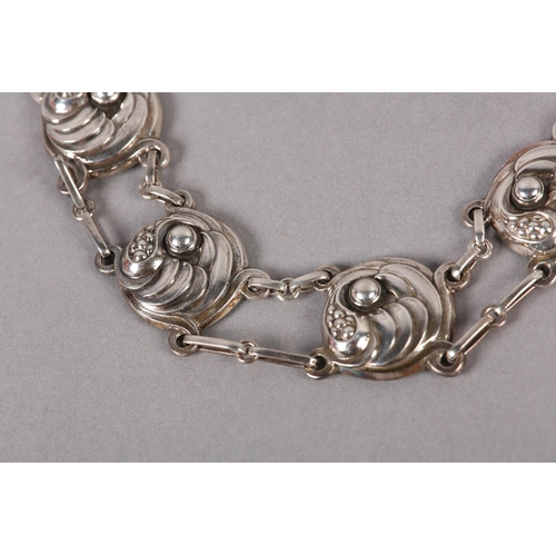 395 - A GEORG JENSEN 19 SILVER NECKLACE, the circular leaf curl and berry links joined by fetter links, si... 