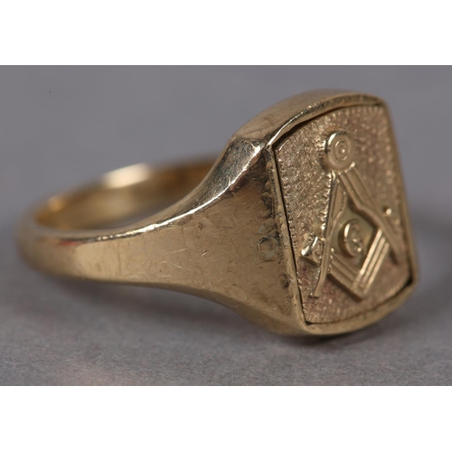 383 - A MASONIC SIGNET RING in 9ct gold, c1970, the rectangular face swivels within broad shoulders, monog... 