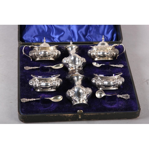 340 - AN EDWARD VII SILVER SIX PIECE COMPOSITE CRUET SET Chester 1903/ 1904 for Colen Hewer Cheshire, balu... 