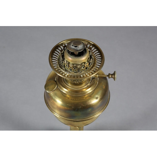 172 - A VICTORIAN BRASS OIL LAMP, on a reeded column, the domed base embossed with grapevine on a black gl... 